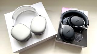 Bose QC Ultra and AirPods Max side-by-side with packaging