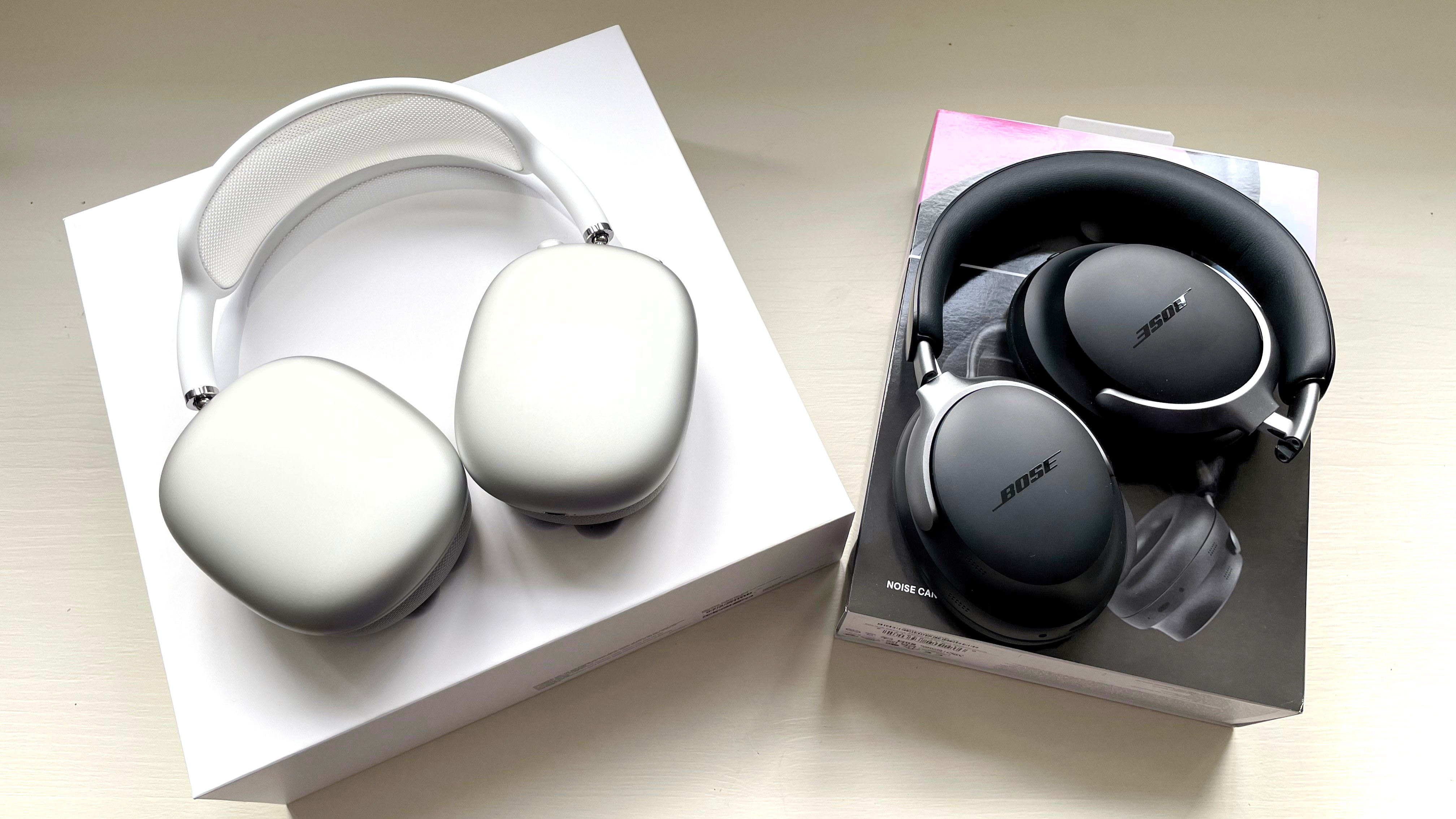 Bose QC Ultra and AirPods Max side-by-side with packaging