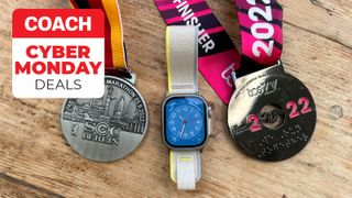 Apple Watch Ultra between Berlin Marathon medal and London Marathon medal