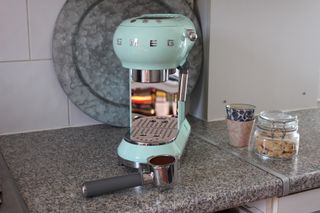 smeg espresso machine on counter top during testing