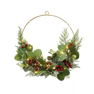 Half full Christmas wreath with berries and eucalyptus