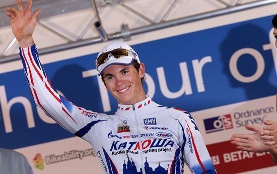 Ben Swift (Katusha) waves from the winner's podium.