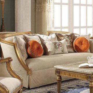 A regency style sofa with cushions