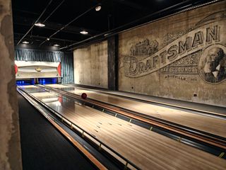 A low light camera sample from a OnePlus 13 showcasing excellent motion capture detail (see the bowling ball traveling down the lane)