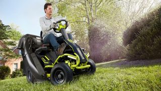 Greenworks vs Ryobi: user reviews. Image of man on Ryobi riding lawn mower