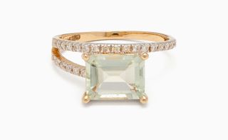 Jamaican designer Ring with diamond stones on the exterior and a large square stone.