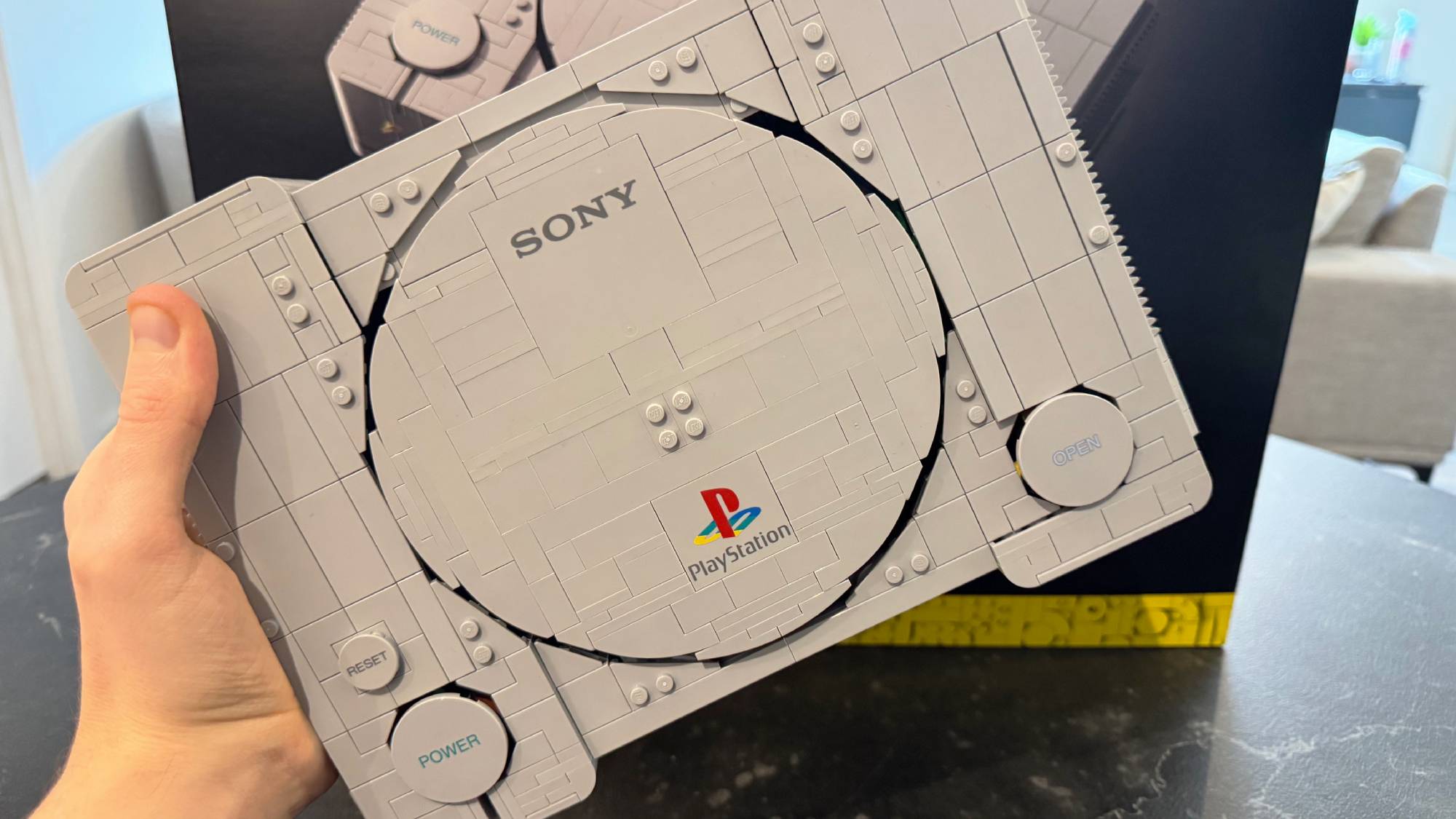 Lego PlayStation model on a table with the box in the background