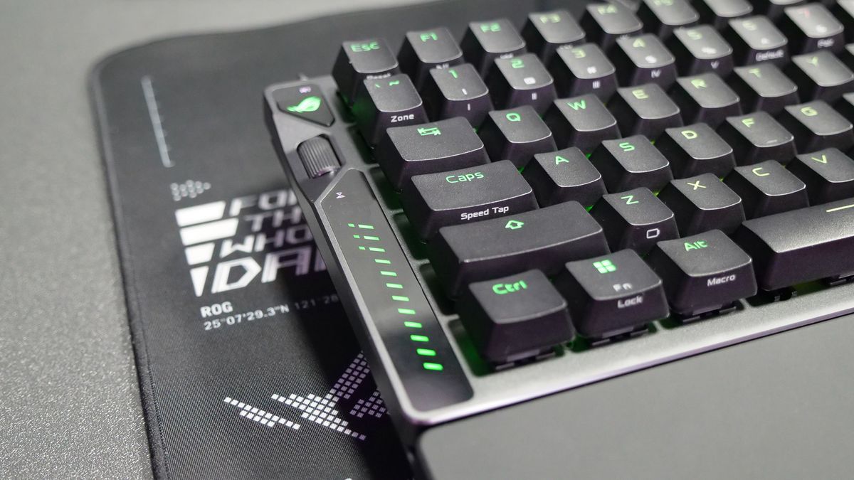Left side of the Asus ROG Falcata gaming keyboard showing the multifunction button and scroll wheel control with LEDs.