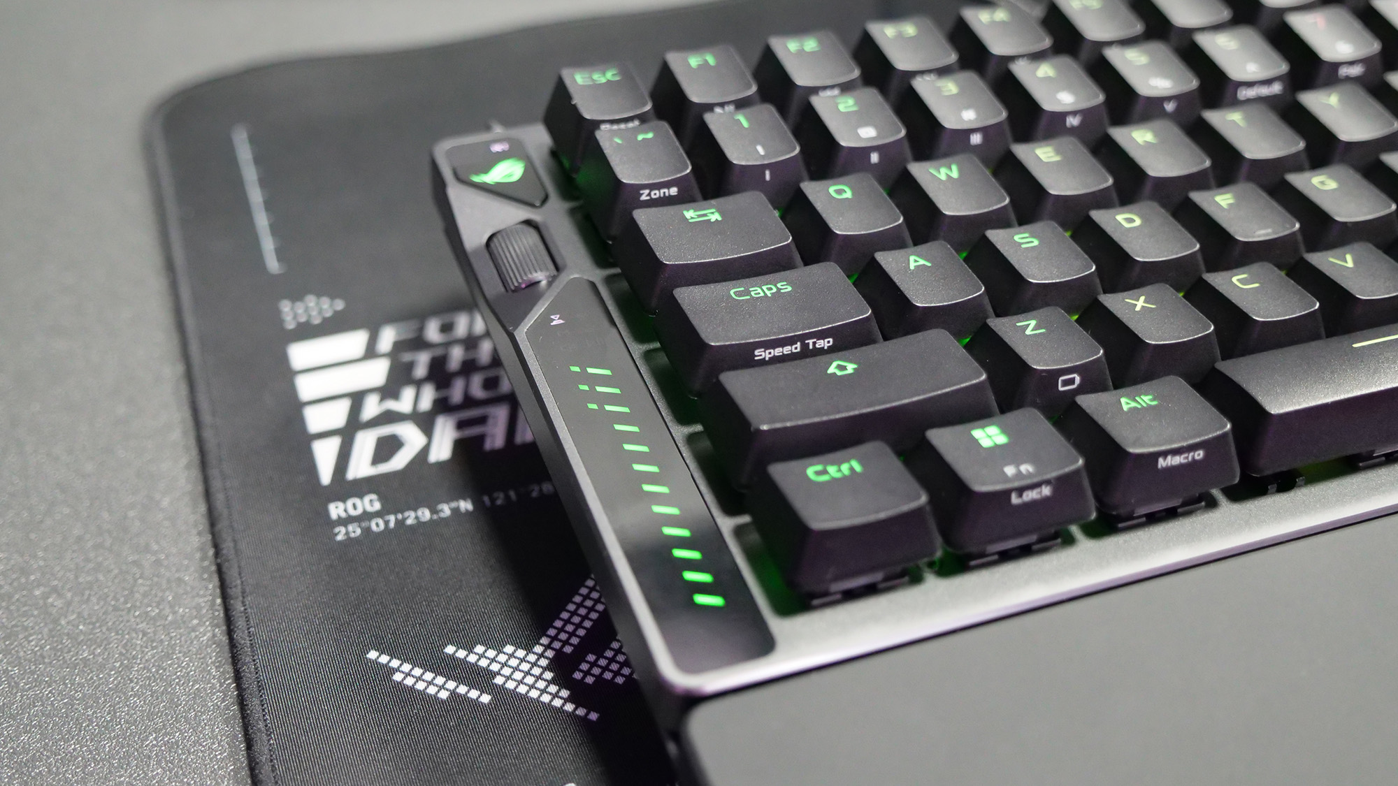 Left side of the Asus ROG Falcata gaming keyboard showing the multifunction button and scroll wheel control with LEDs.