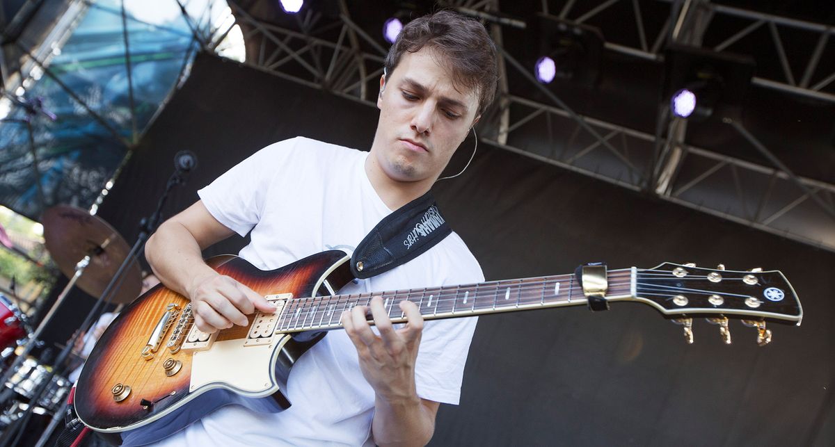 Matteo Mancuso wears a white T-shirt and plays his Yamaha Revstar in Tobacco Burst live onstage during a soundcheck before his festival appearance at at Casa del Jazz, Rome.