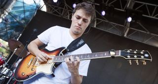 Matteo Mancuso wears a white T-shirt and plays his Yamaha Revstar in Tobacco Burst live onstage during a soundcheck before his festival appearance at at Casa del Jazz, Rome.