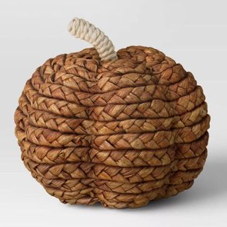 A brown woven pumpkin figurine is one of the best Target fall decor items.