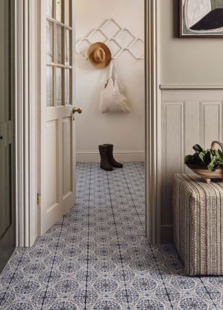 Entrance hall with blue and white floor tiles