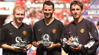 Manchester United trio Paul Scholes, Ryan Giggs and Gary Neville pose with their awards after being named in the Premiership team of the decade in 2003.