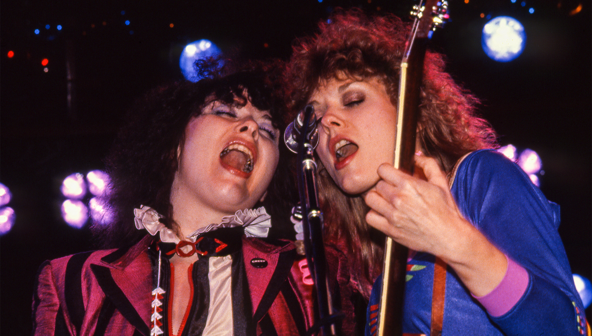 Ann and Nancy Wilson perform with Heart at Concord Pavilion on August 1, 1980 in Concord, California.
