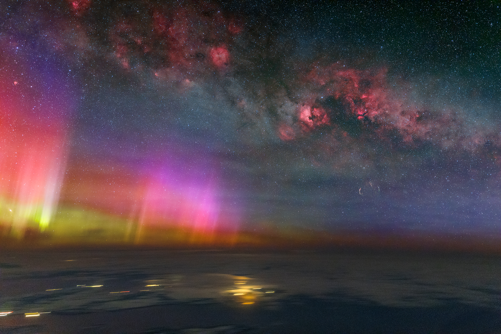 A composite photograph taken by pilot Ralf Rohner of the aurora and Milky Way above the clouds
