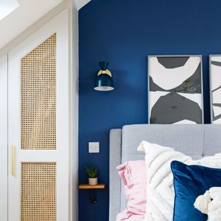 Bedroom with wardrobe built in underneath eaves