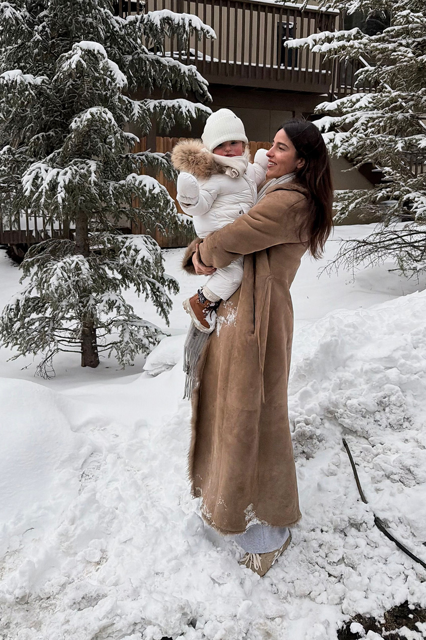 Bettina Looney wearing fur-trimmed coat in the snow
