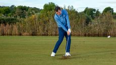 PGA pro Dan Grieve hitting an iron shot on the 18th hole at Lumine Golf Resort