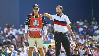 Joe LaCava and Patrick Cantlay eye up a putt