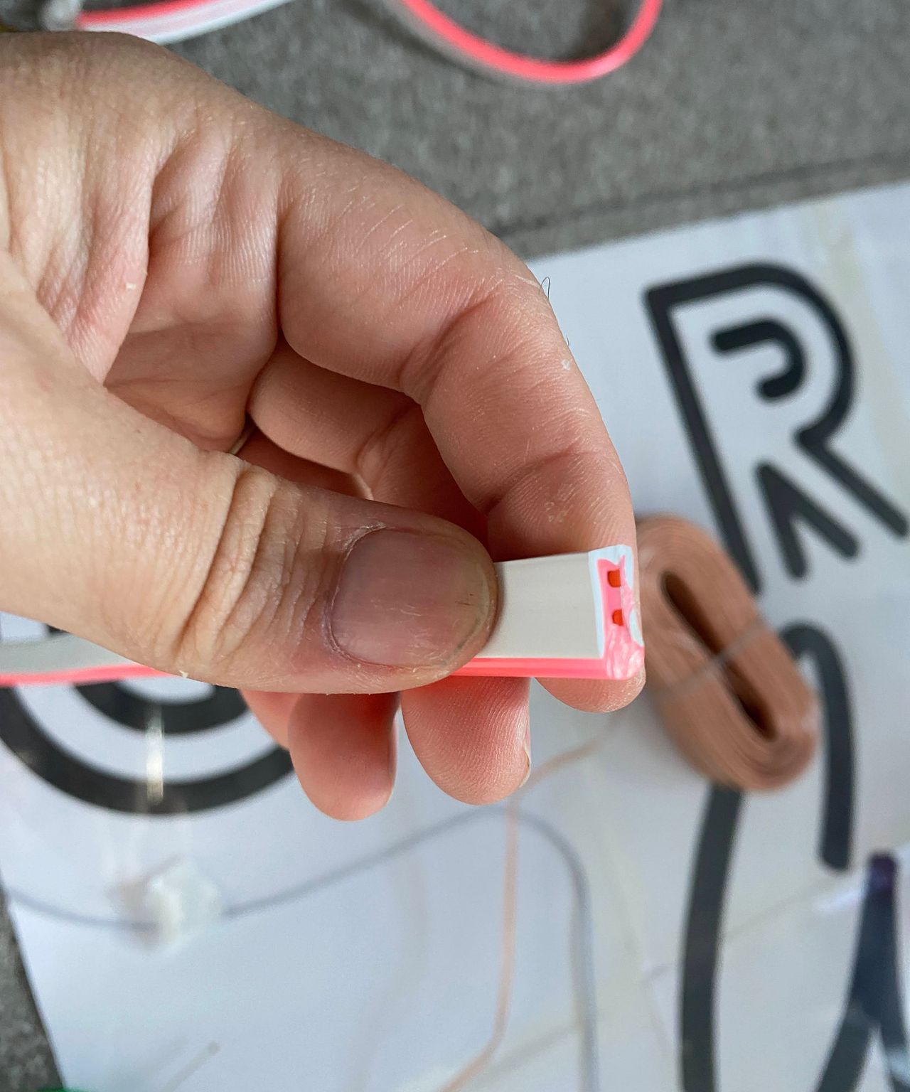 DIY Neon rope sign - a close up shot of Jasmine Guerney displaying positive and negative points