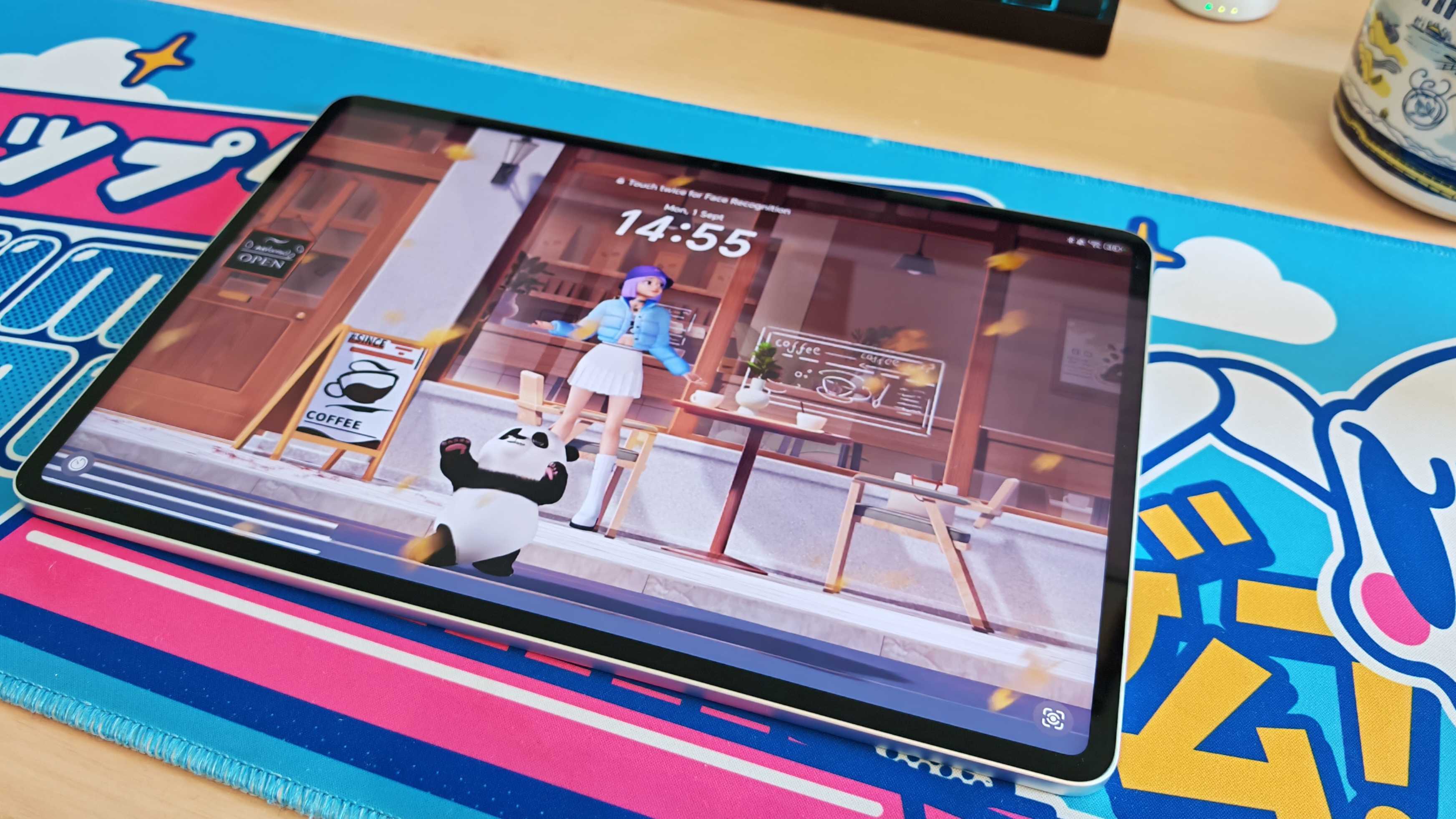 The Honor MagicPad 3 placed on a colorful desk mat.