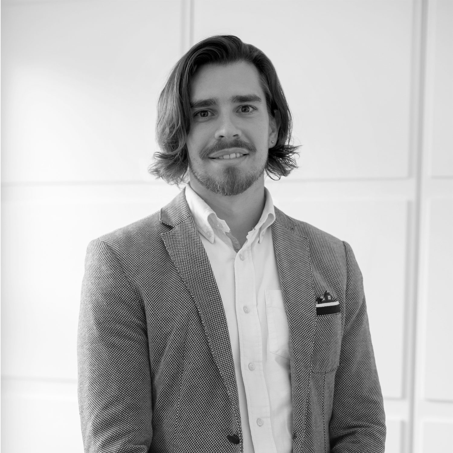 black and white headshot of Matthew Allen-Olivar a young man with facial hair