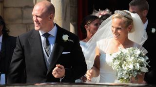 Mike and Zara Tindall smile after their wedding at Canongate Kirk