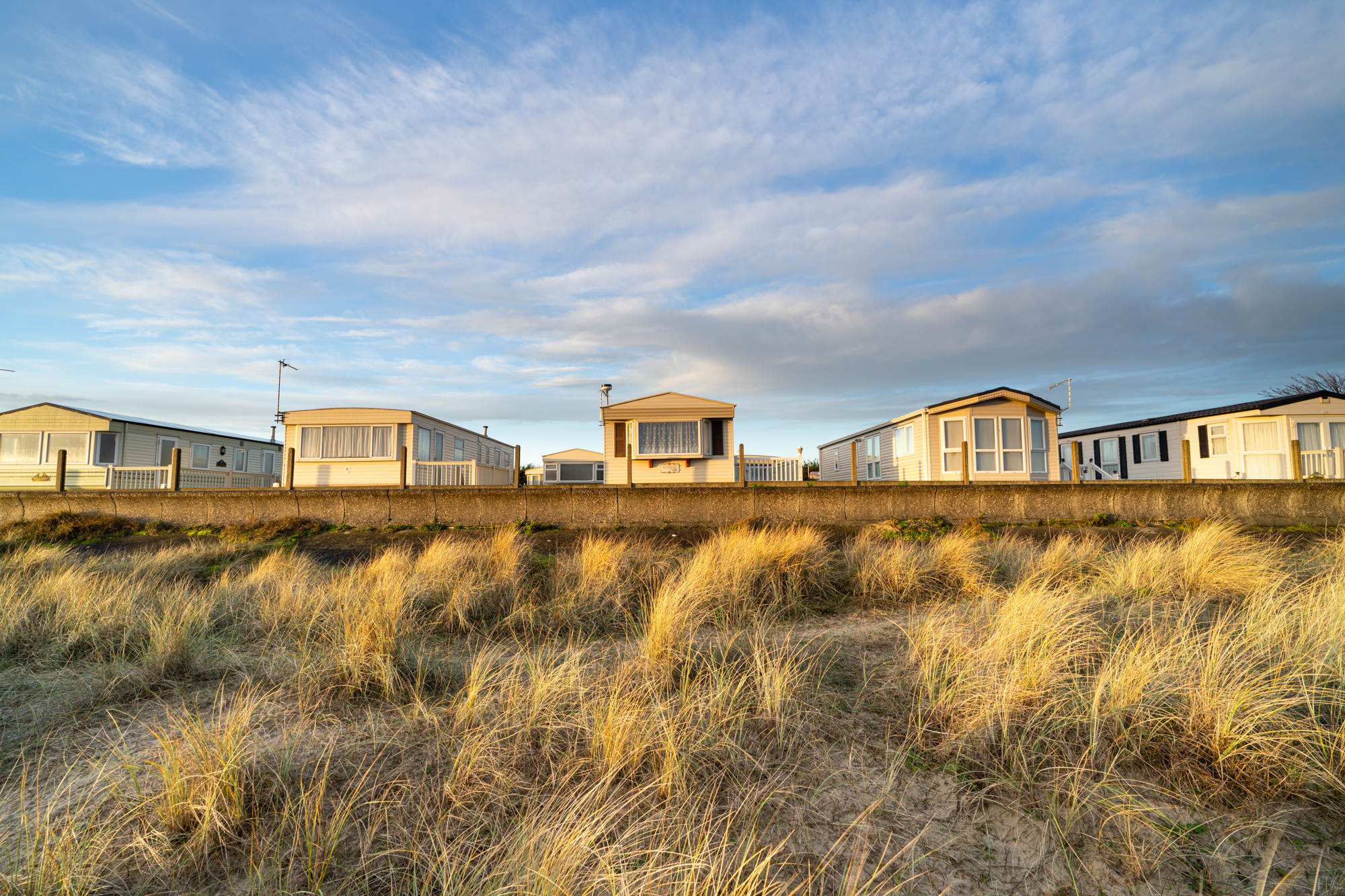 Beach homes in the sun taken with the Sony A7R V