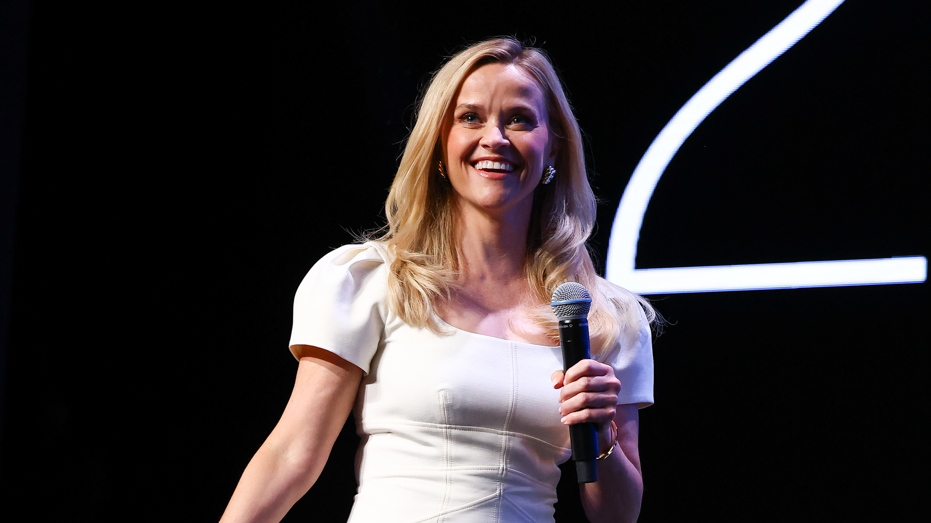 Reese Witherspoon wears a little white dress during Cannes Lions International Festival Of Creativity 2025.