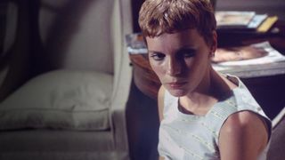 Rosemary looking concerned at something off camera in Rosemary's Baby.