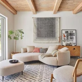 A cream boucle sofa in a neutral living room