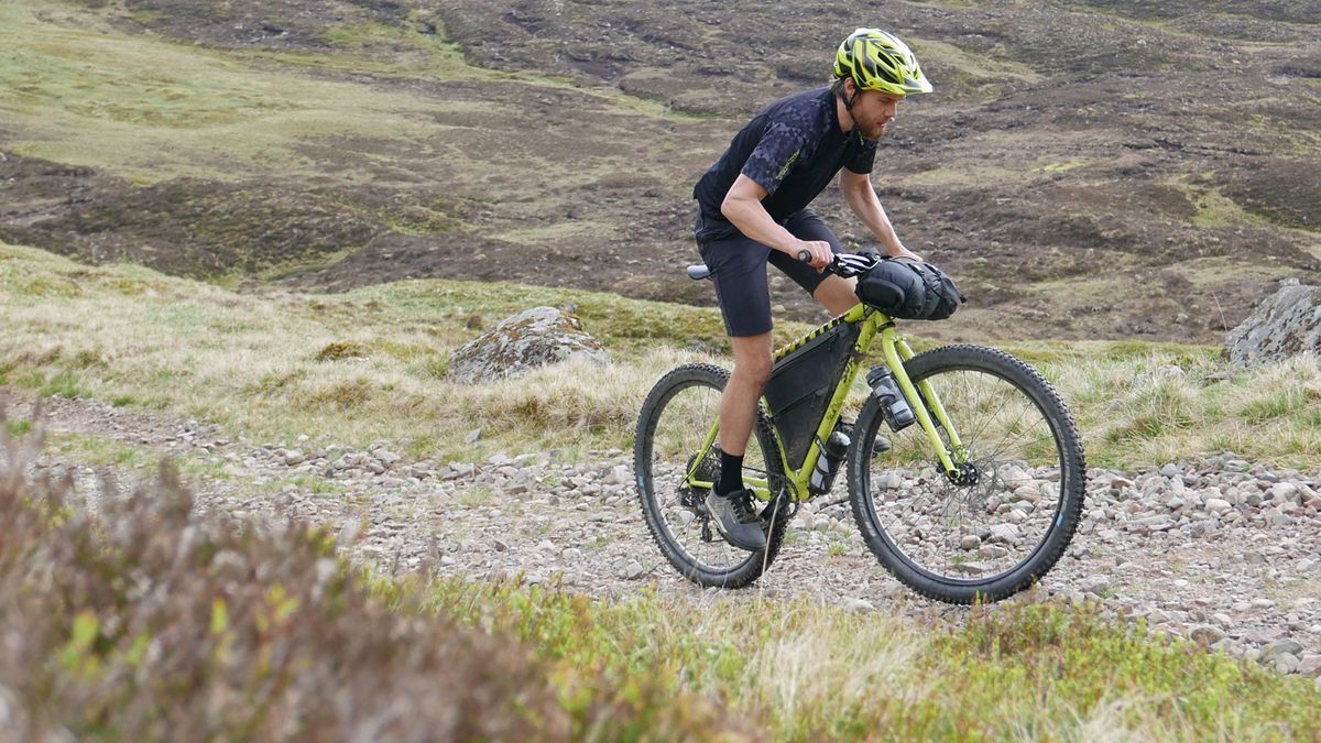 Climbing on a lightweight bikepacking bike