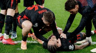 Raphinha is congratulated by Barcelona team-mates after scoring a late winner away to Benfica in the Champions League in January 2025.