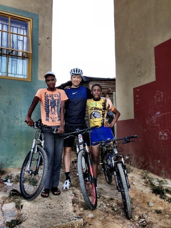 Christoph Sauser poses with some youths from the Kayamandi Township