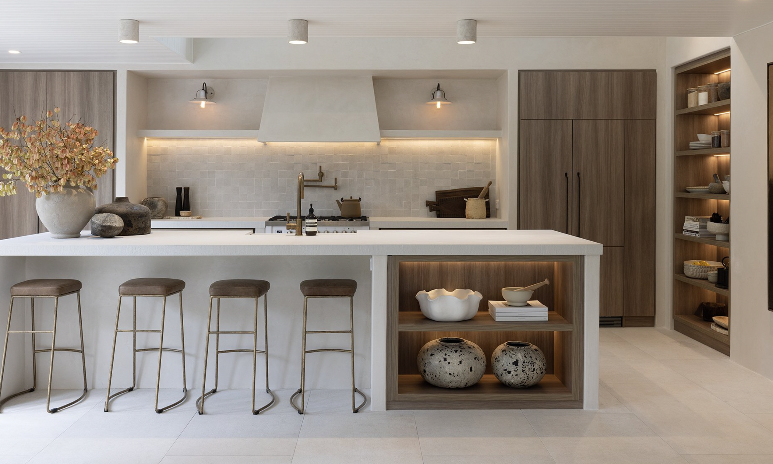 A kitchen with recessed downlights installed above the counter