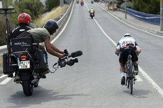 Tony Martin being tracked by a TV cameraman on the 2013 Vuelta a España (Watson)
