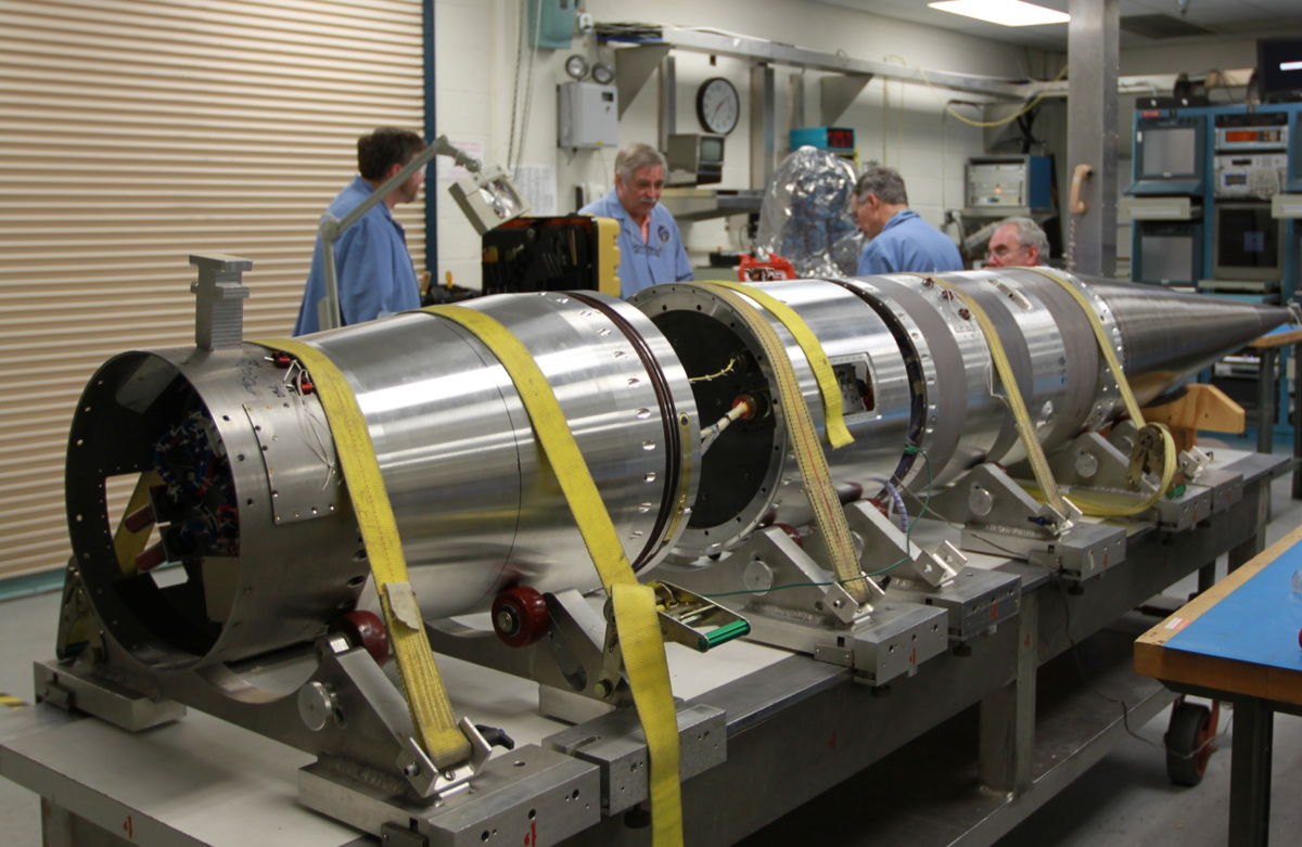 NASA scientists work on a sounding rocket slated to launch on Jan. 29, 2013, to create potentially dazzlingly bright red streaks in the night sky over the U.S. East Coast. The mission will launch from NASA's Wallops Flight Facility in Virginia.
