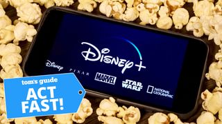 A phone with the Disney Plus logos is surrounded by popcorn and an "Act fast" graphic in the corner.