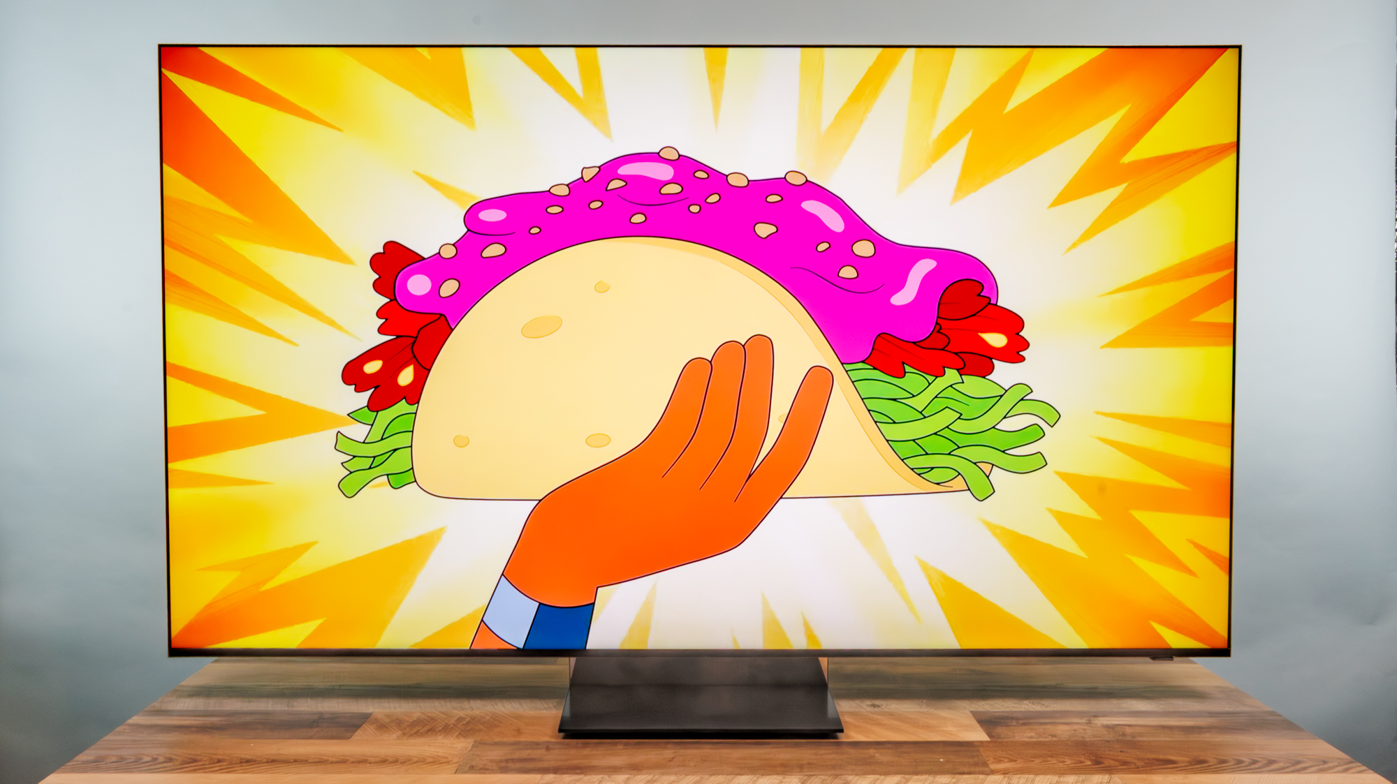 A Samsung R95H Micro RGB TV on a desk