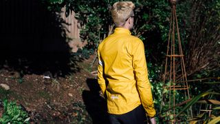 A yellow rapha core waterproof jacket