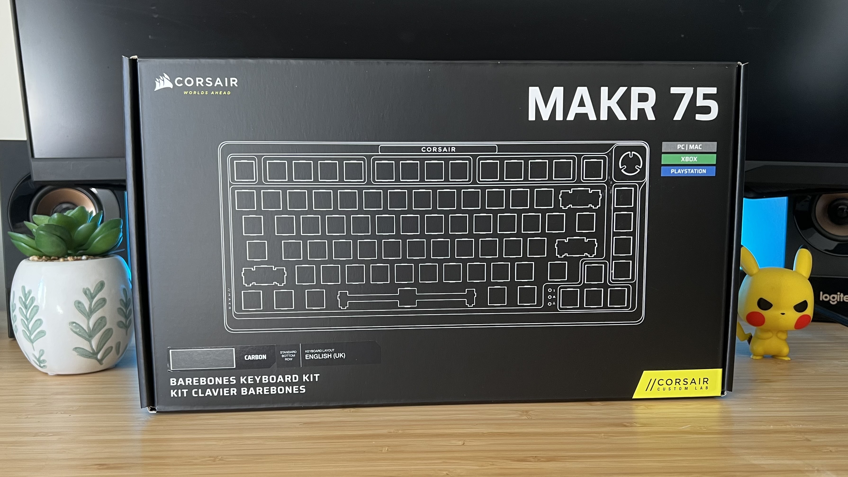 Corsair MAKR 75 keyboard packaging on a wooden desk