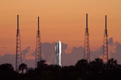 As the sun comes up over Cape Canaveral Air Force Station in Florida, preparations are under way at Space Launch Complex 41 to launch the United Launch Alliance Atlas V-551 launch vehicle car