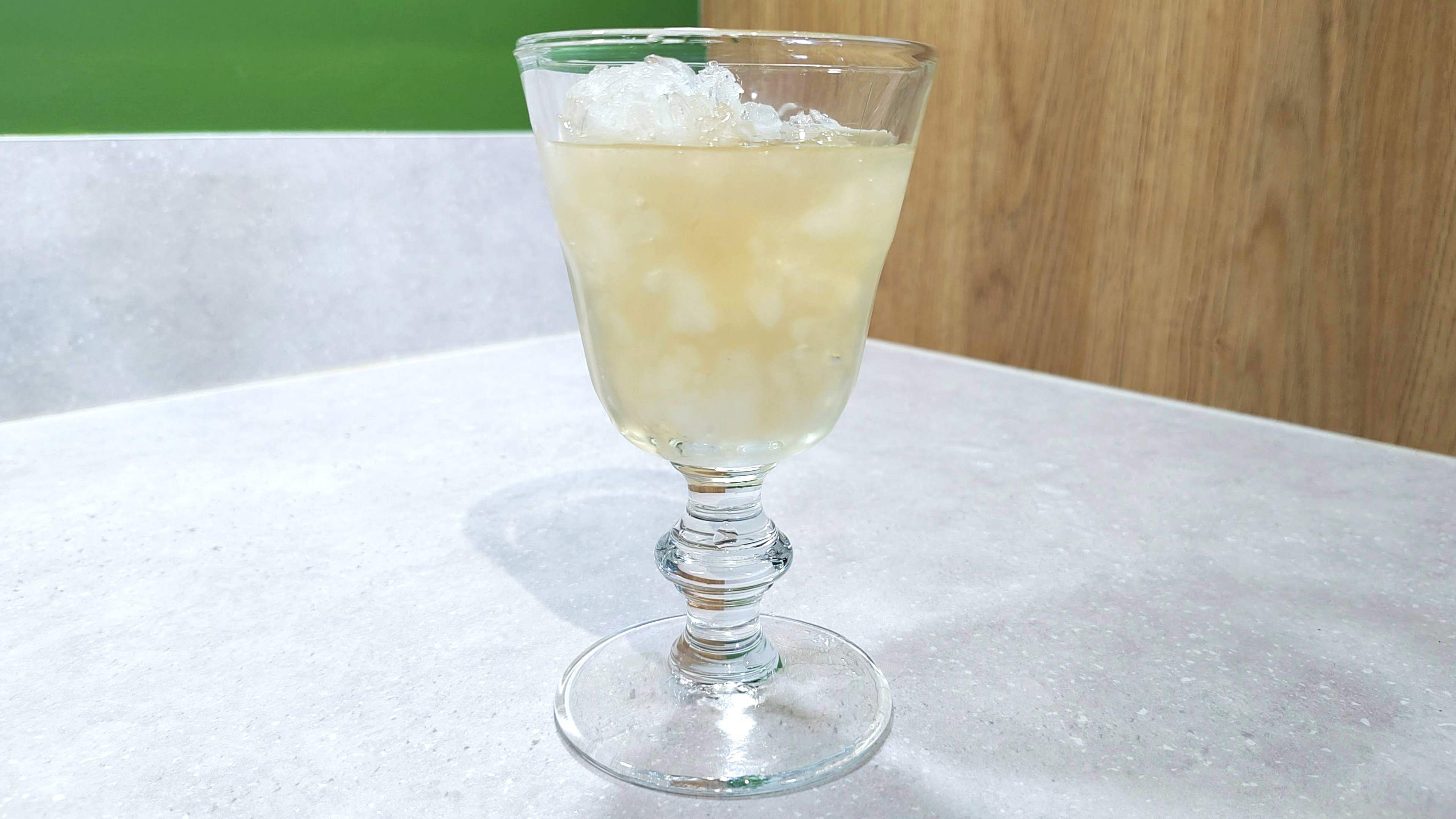 Glass of apple juice with ice chopped using Bosch ErgoMaster Serie 3 blender
