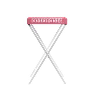 A pink tray table with steel legs