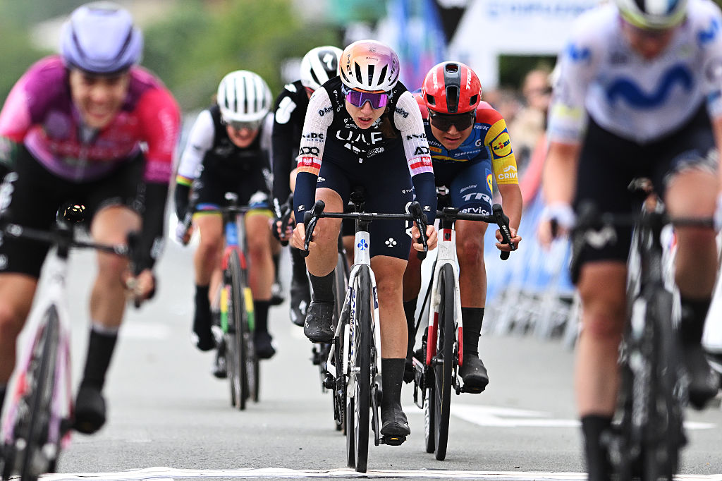 ZARAUTZ, SPAIN - MAY 15: Dominika Wlodarczyk of Poland and UAE Team ADQ crosses the finish line during the 5th Itzulia Women 2026, Stage 1 a 121.3km stage from Zarautz to Zarautz / #UCIWWT / on May 15, 2026 in Zarautz, Spain. (Photo by Szymon Gruchalski/Getty Images)