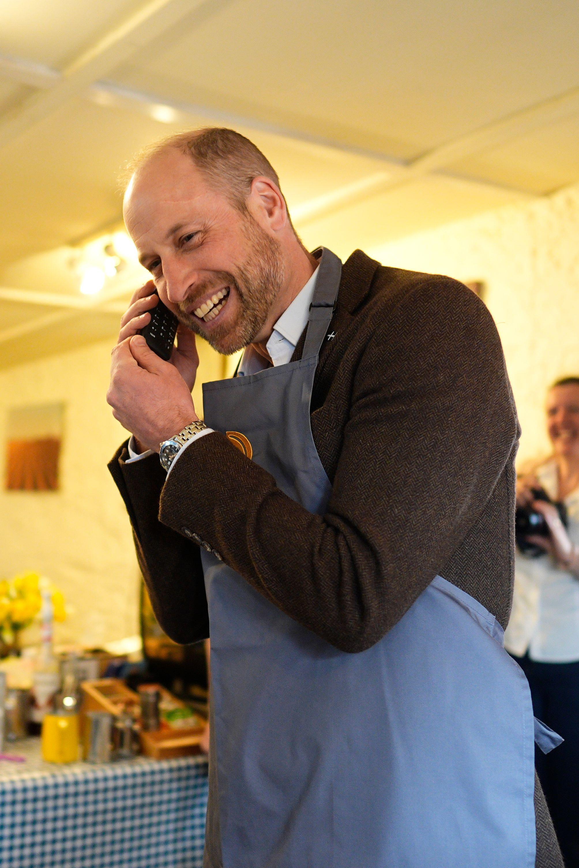3DY0TKG The Prince of Wales, known as the Duke of Cornwall while in Cornwall, answers the phone to a customer at the shop during his visit to the Gear Farm Pasty Company, a family-run farm known for producing traditional Cornish pasties in St Martin, Helston, as he visits Cornwall for St Piran's Day. Picture date: Thursday March 5, 2026.