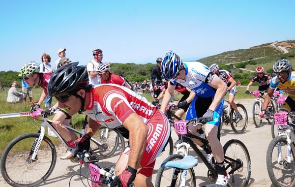Men's super D start on a fireroad