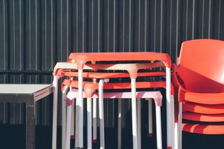 white and orange plastic deck chairs