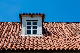 clay s shaped pantiles on roof with dormer window